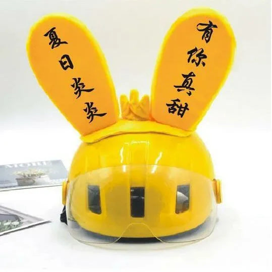 Rabbit Glow Ears helmet decoration with locomotive and ski designs on a Velcro base