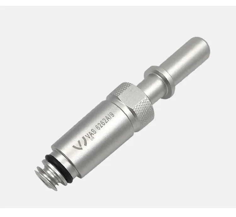 Silver metal transmission refuelling joint for automotive workshop use.