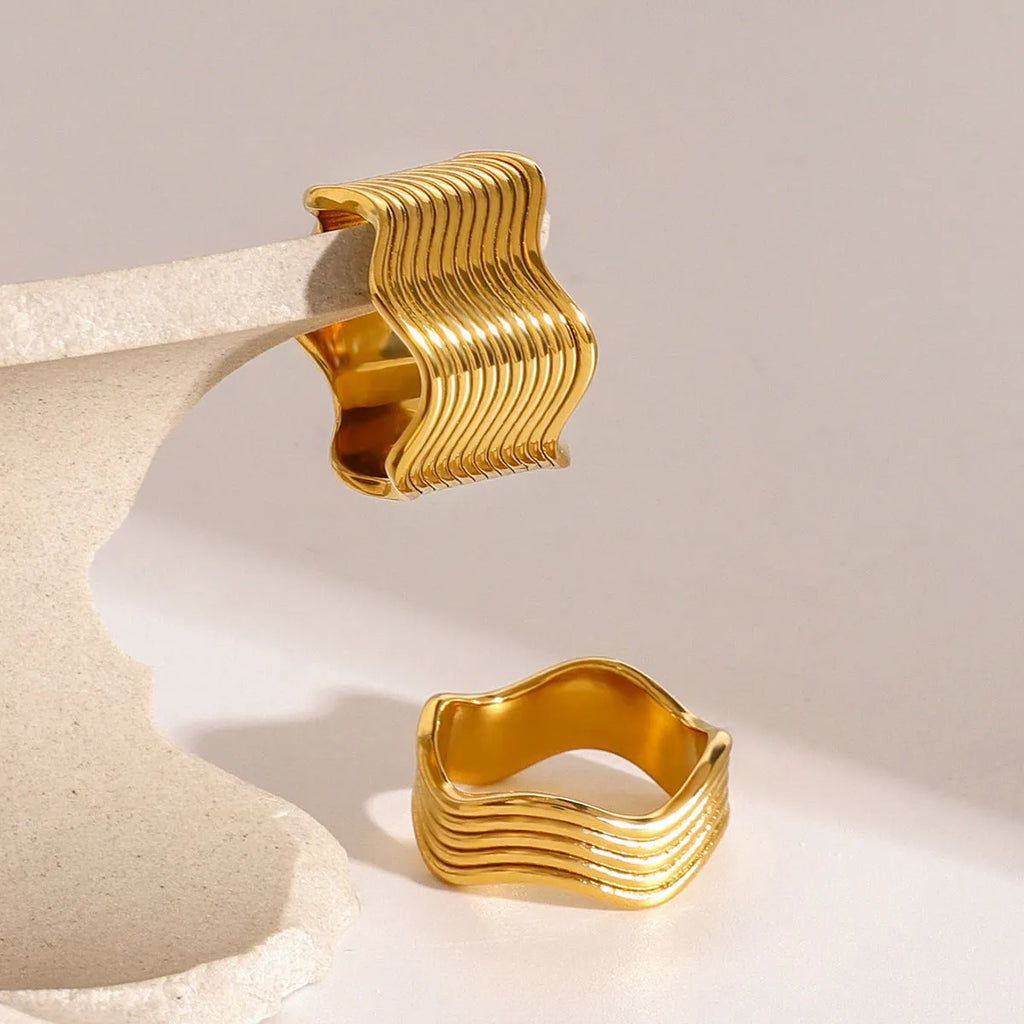 Stainless steel geometric wave pattern ring for women with wide band design