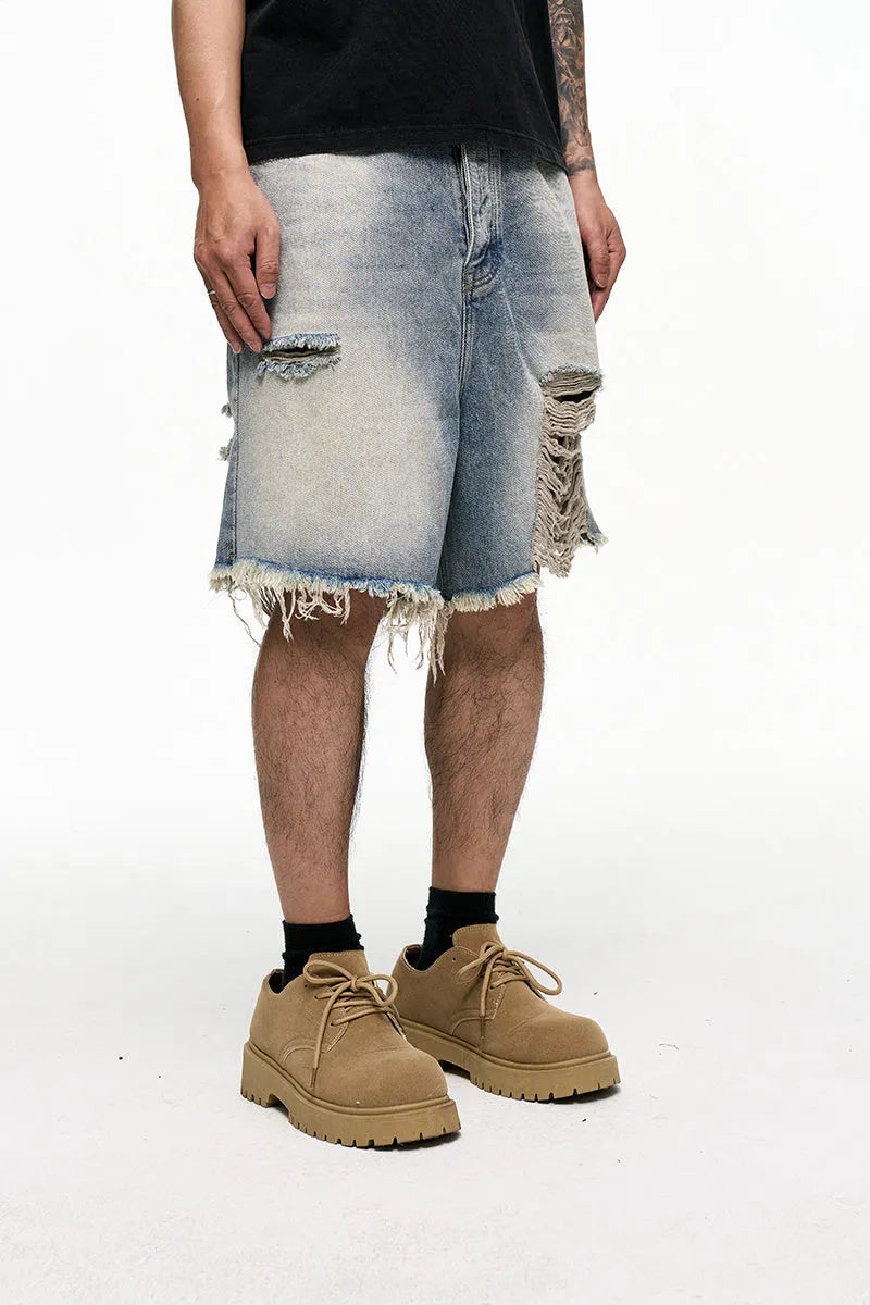 Light blue men's baggy denim shorts with wide leg and zipper fly