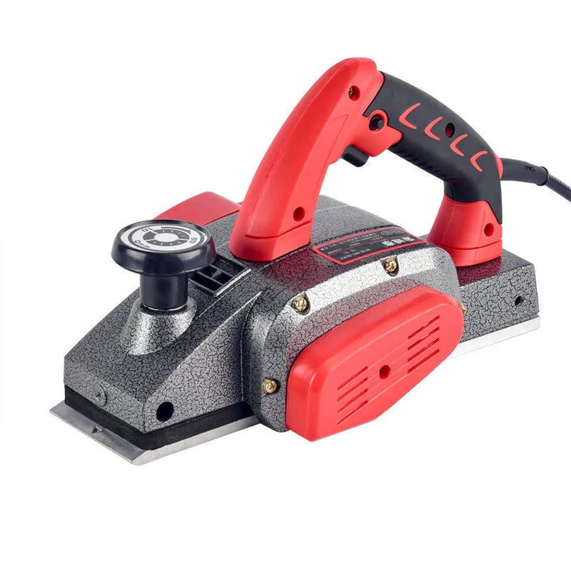 Red desktop electric planer with aluminium housing for woodworking showing 82mm planing width