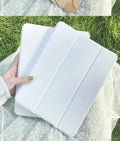 Cartoon rabbit design silicone tri-fold protective case for an iPad, showing its flat profile and stand function.