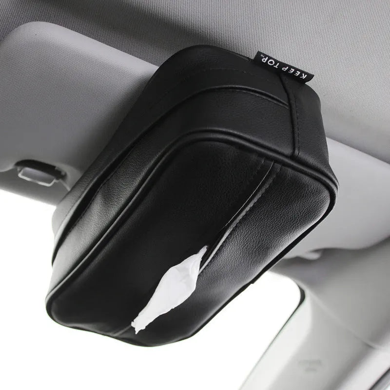 Black leather car hanging storage box with open top, shown next to a beige medium-sized version.