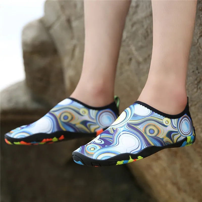 Blue Lycra beach wading shoes with elastic upper and lightweight EVA sole for swimming.