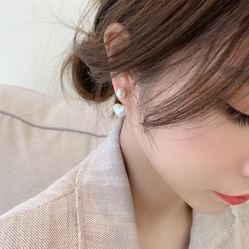 Korean style heart-shaped pearl stud earrings for women with artificial gem inlays on electroplated alloy.