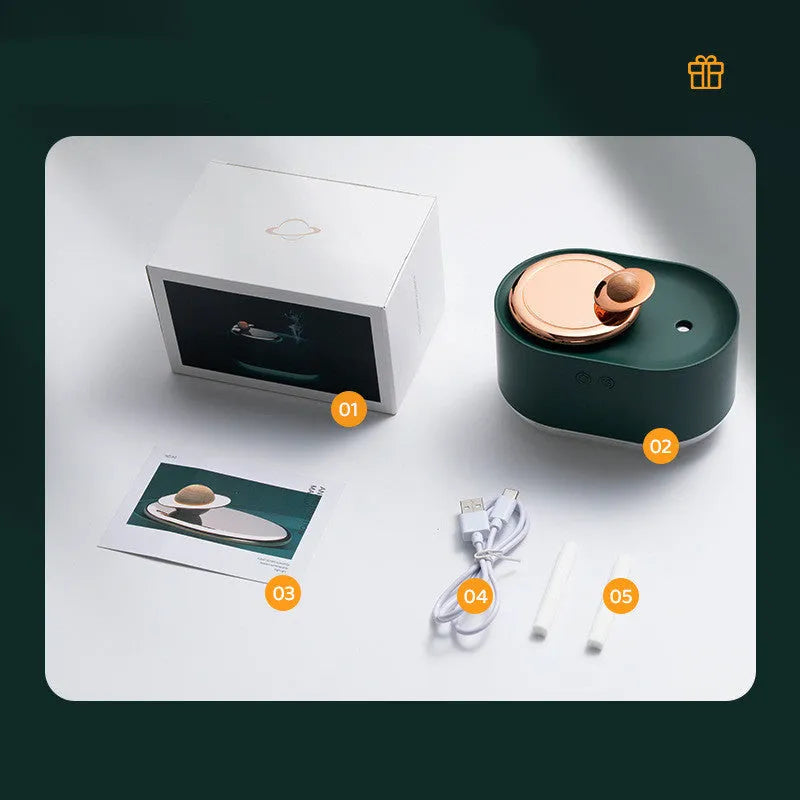 Rotating planet USB humidifier with night light in green colour showing mist output