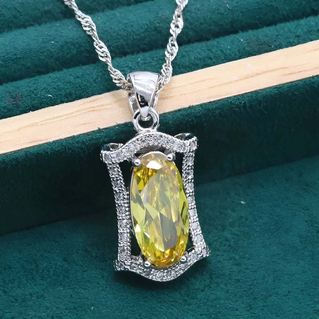 Women's zircon dinner jewellery set with necklace, bracelet, earrings, and ring in yellow or olive green colours