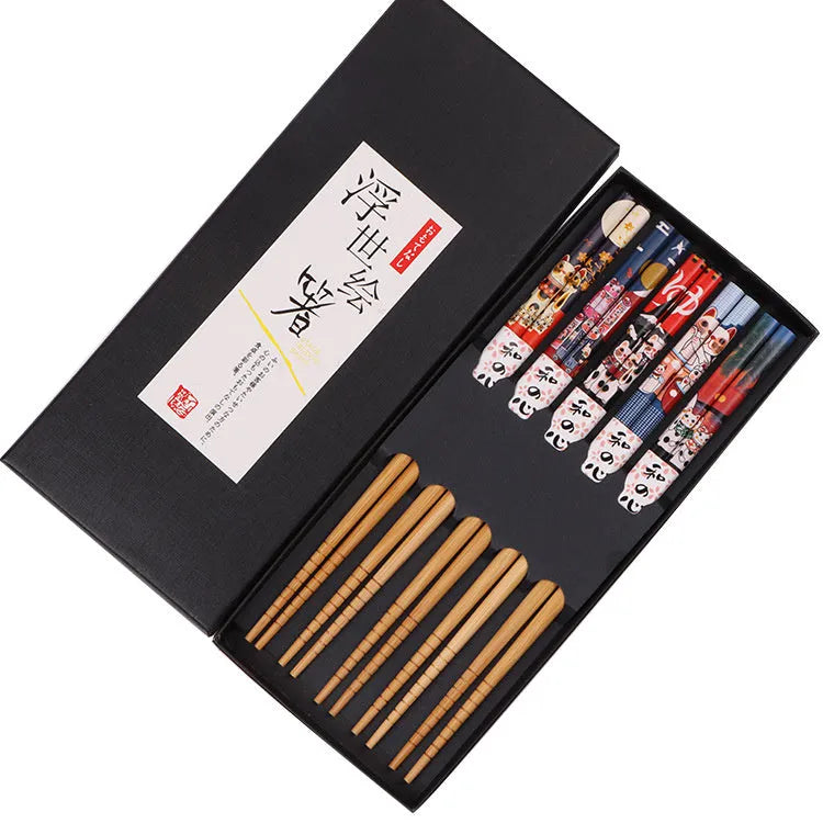 Set of five pairs of bamboo chopsticks with Japanese cartoon pattern in a gift box.