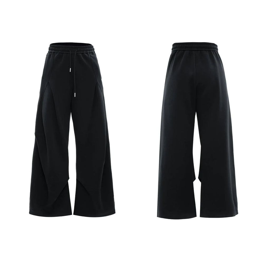 Men's dark grey cotton sports suit with V-neck short sleeve jacket and matching bottoms showing padded shoulder detail