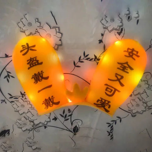 Rabbit Glow Ears helmet decoration with locomotive and ski designs on a Velcro base