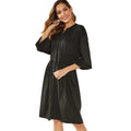 Women's black A-line midi dress with elastic waist, long sleeves, and cinched belt detail