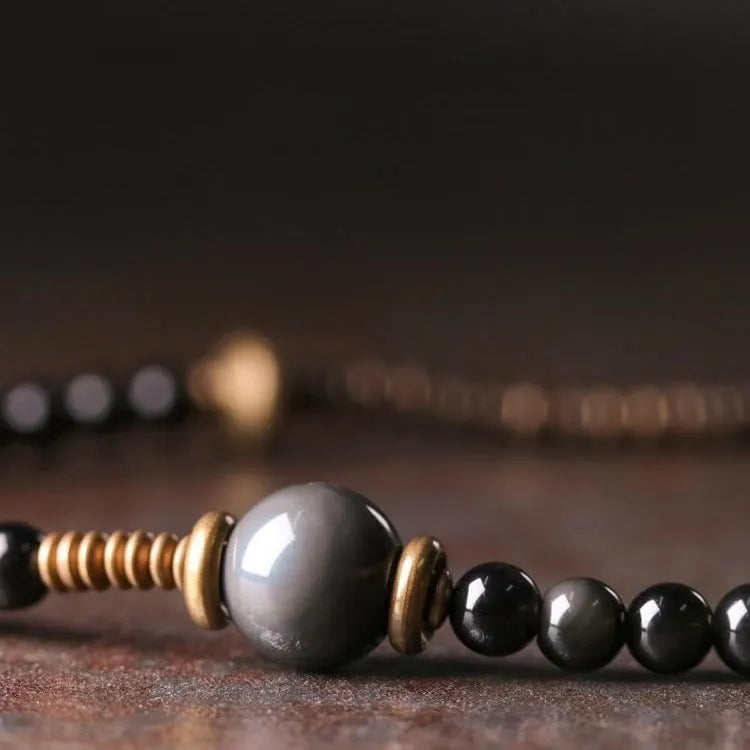 Black geometric multi-layered beaded bracelet with colourful retro beads and adjustable fit