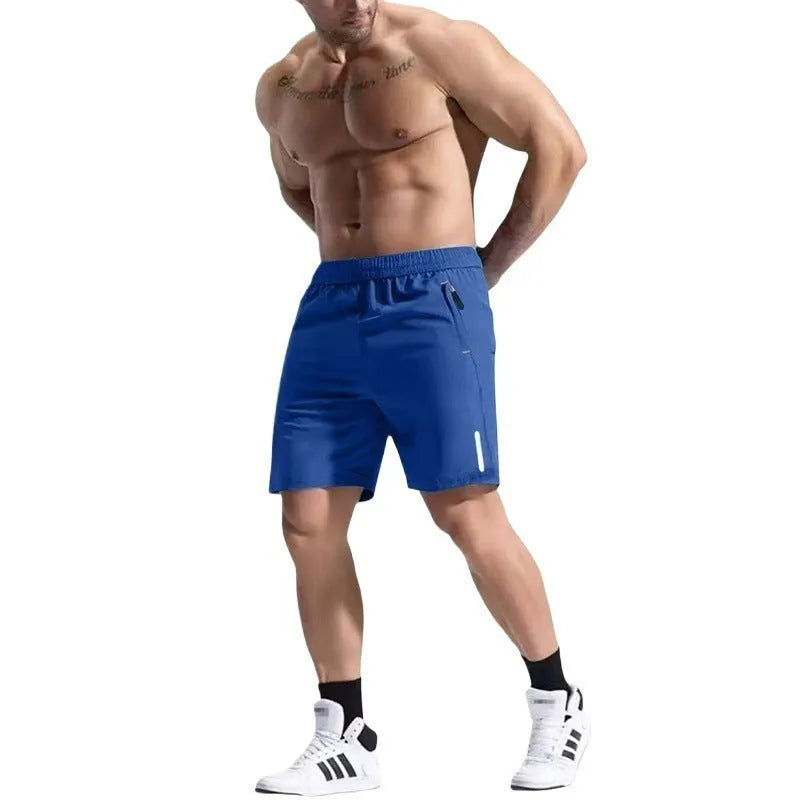 Men's grey elastic waist sports shorts made from polyester and bamboo fibre fabric on a man running outdoors.