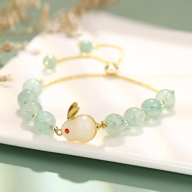 Rabbit charm bracelet with green aventurine or strawberry quartz stones on gold-plated chain