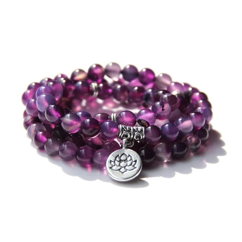 A vintage-style women's bracelet made from natural stone with a geometric lotus design.