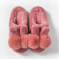 Women's fluffy pink rabbit fur winter slippers with a high overshoe design and sewn sole.