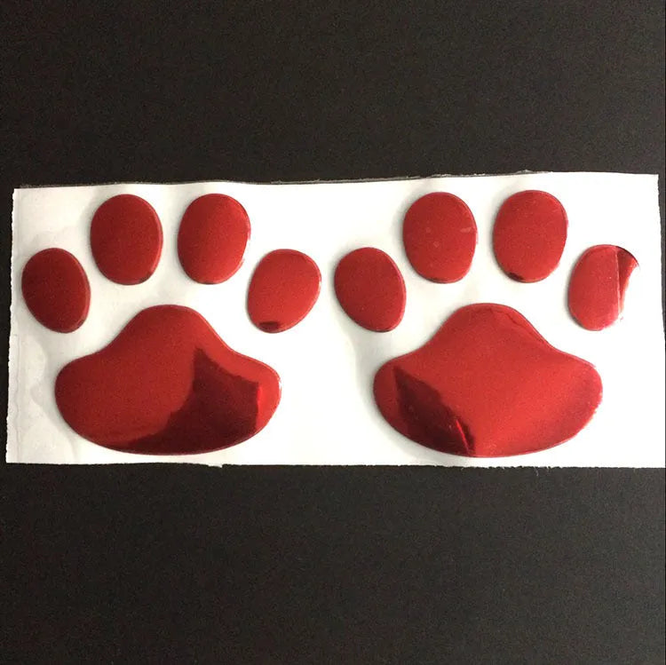 PVC car sticker pair with hand-shaped brush design showing dog footprints in multiple colour options