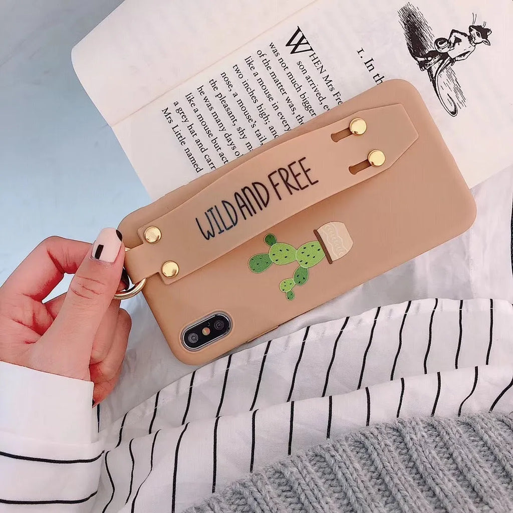 Green graffiti design iPhone wristband case with adjustable silicone strap attached to an iPhone model.