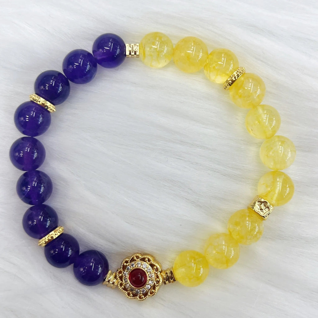 Handmade women's yellow and purple crystal bracelet with amethyst beads on wrist
