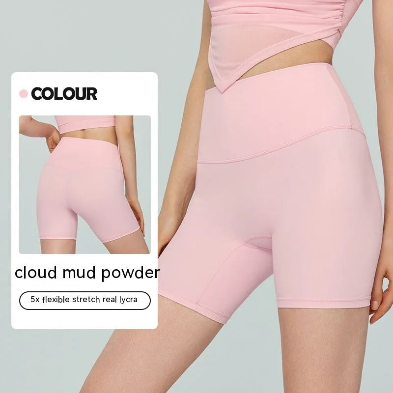 Women's high waist Lycra yoga shorts in leaf green colour, shown as short-length fitness pants.