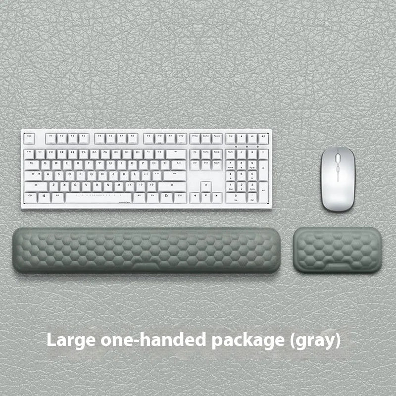 Memory foam mouse wrist pad with silicone bottom in black cloth cover on computer desk