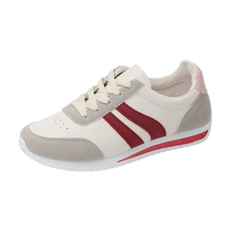 Blue and red low top lace-up leisure sneaker with a round toe and rubber sole.