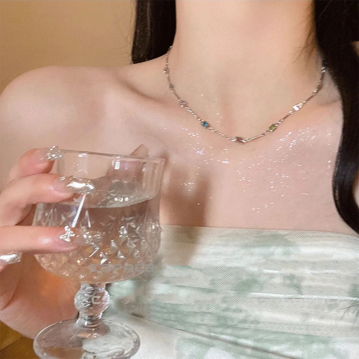 Gold alloy geometric necklace with a square colour artificial crystal pendant on a clavicle-length chain.