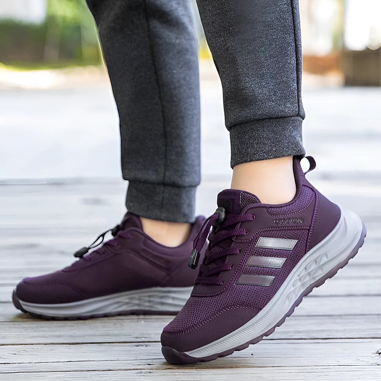 Breathable mesh elastic slip-on casual shoes for men and women in purple, black, and grey.