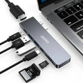 USB Type C adapter hub with multiple ports including Thunderbolt 3, HDMI, SD card slot, and USB 3.0