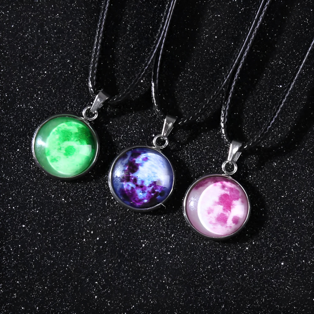 Christmas moon and night sky luminous constellation pendant on a glass necklace chain.