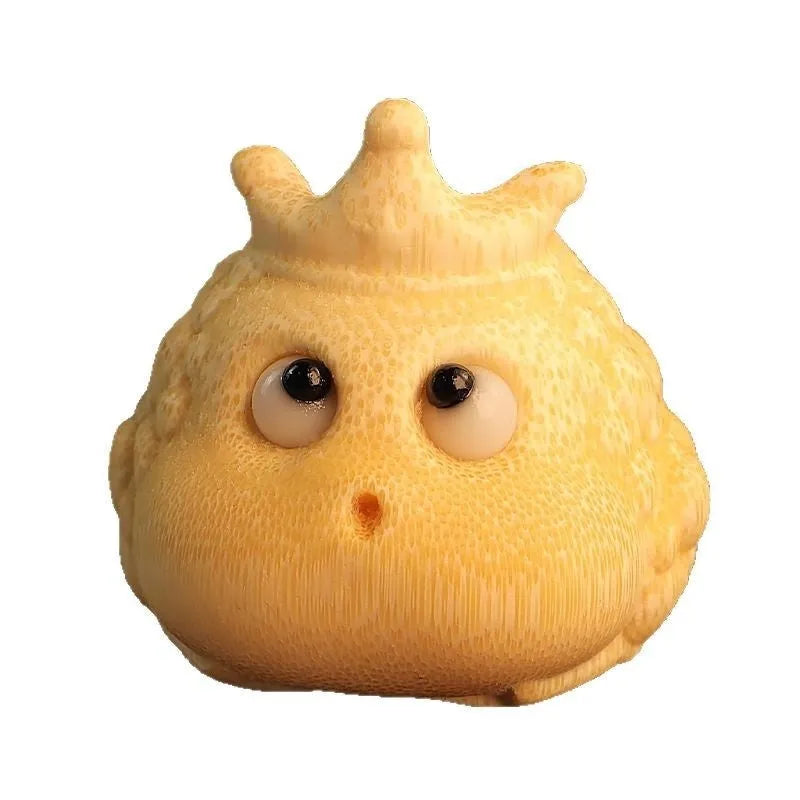 Solid bamboo carving of a cute style Crown Princess Toad ornament on display