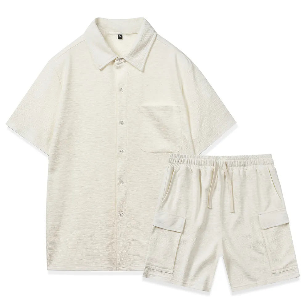 Beige elastic waist shorts and short sleeve top two-piece set laid flat.