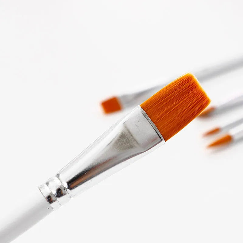 Set of six acrylic watercolour paint brushes with wood handles on a white background.