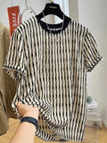 Black and white striped men's loose-fit short sleeve casual shirt made from linen blend fabric.