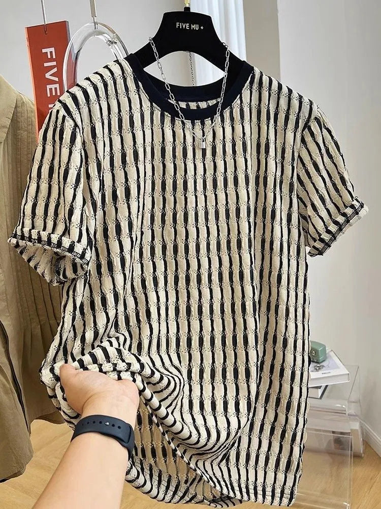 Black and white striped men's loose-fit short sleeve casual shirt made from linen blend fabric.