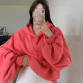 Watermelon red women's loose hooded pullover sweater made from mulberry silk fabric.