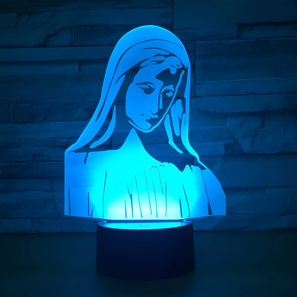 3D LED night light showing dual-ring pattern on acrylic plate with ABS base and control button.
