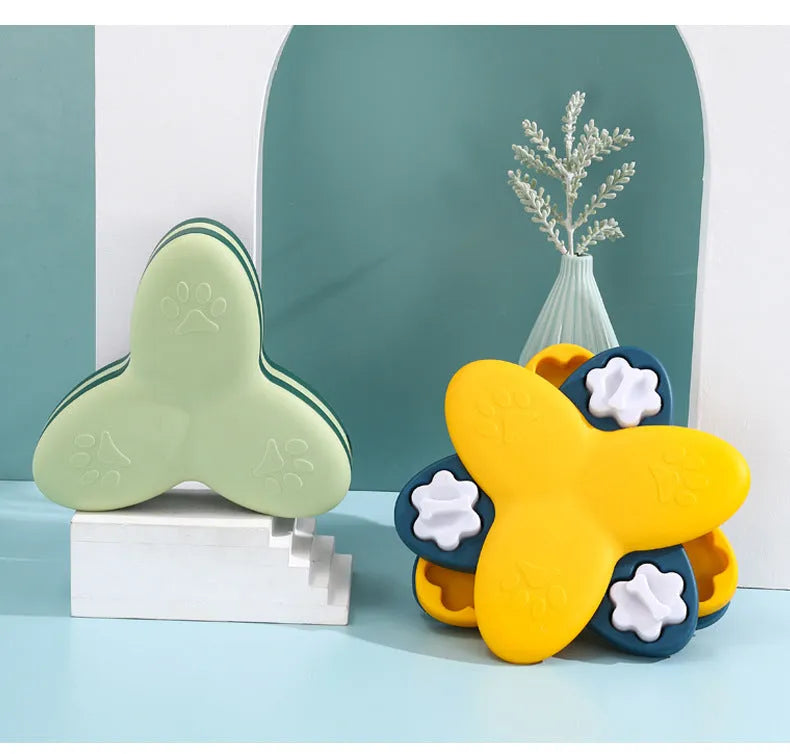 Green and yellow dog puzzle toy with rotatable compartments and bone-shaped covers