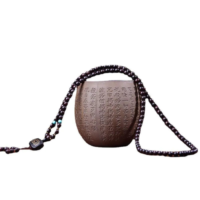 Zambia rosewood bead bracelet with flat lotus pendant showing 108 wooden beads