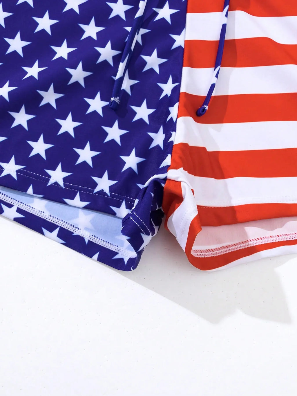Women's high waist boxer style swimsuit with drawstring and red, white, and blue stars and stripes pattern.