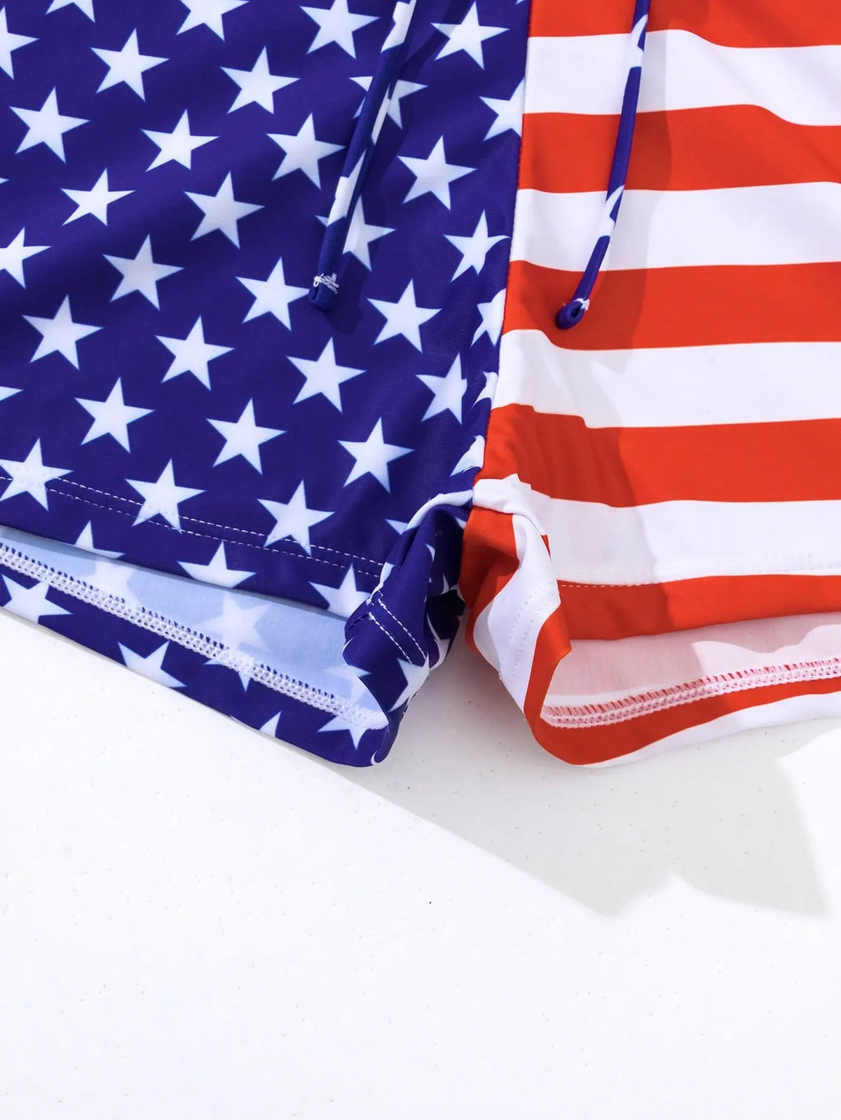 Women's high waist boxer style swimsuit with drawstring and red, white, and blue stars and stripes pattern.