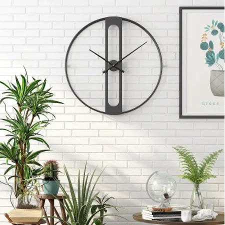 Round metal wall clock with 50cm diameter face in black or gold finish.