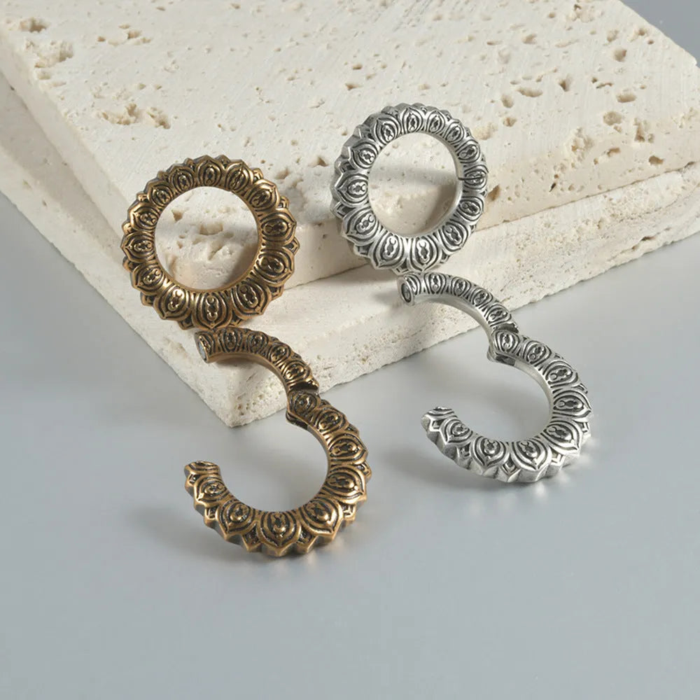 Polished stainless steel retro magnetic earrings featuring hollow heart and lotus geometric shapes in antique silver and gold finishes