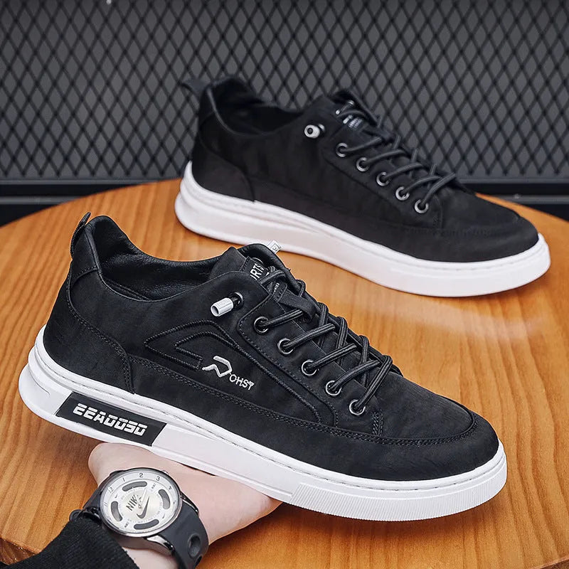 Grey men's canvas casual shoes with lace-up front and decorative stitching details