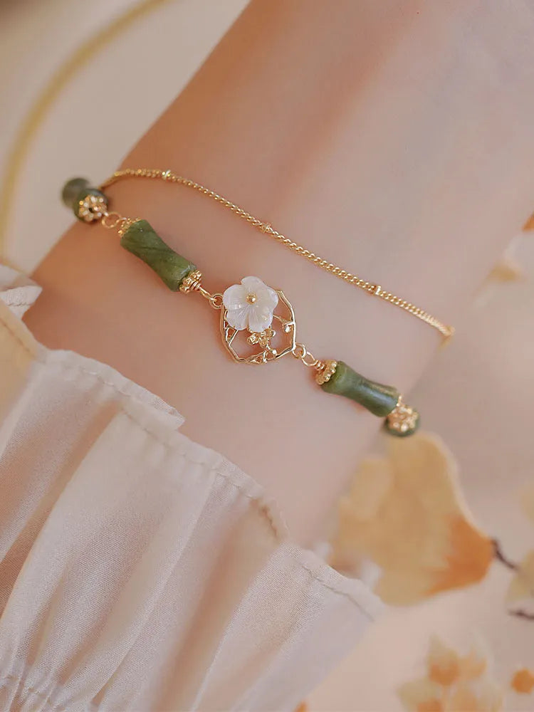 Natural green Olivine double layer bracelet with Twin Bells of Ireland and Olive Branch charms.