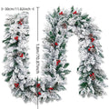 White flocked snow Christmas rattan vine garland draped on a wooden staircase banister.