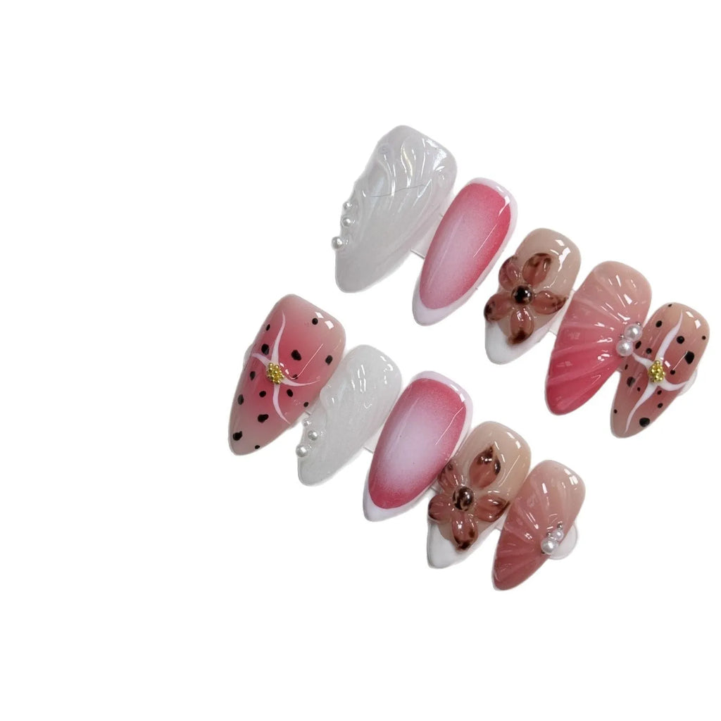 Hand-painted three-dimensional carved nail beauty patches in candy colours on an almond-shaped nail.