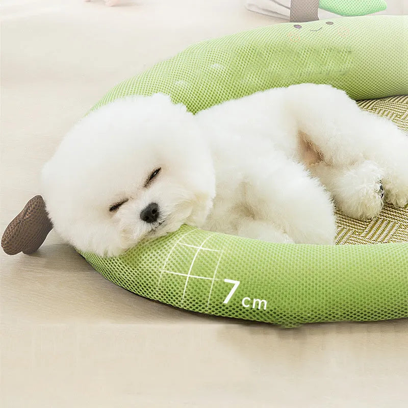 Green pet cooling mat with raised fruit backrest for dogs or cats on a wooden floor