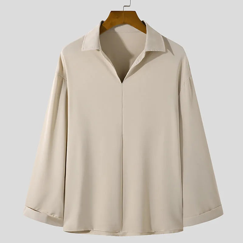 Man wearing loose fit long sleeve pullover shirt in solid colour for work casual wear