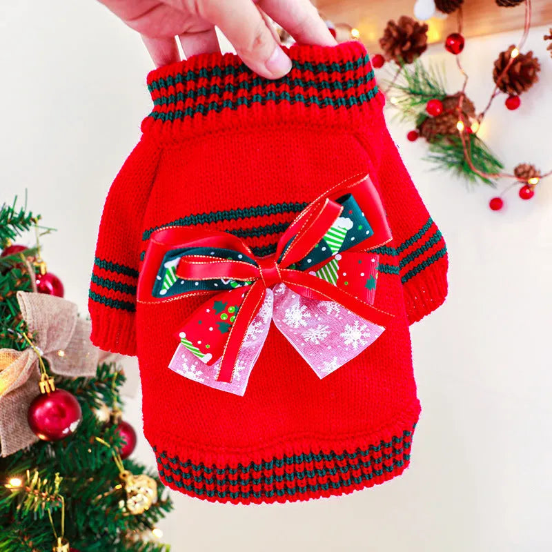 Red Christmas sweater for a dog on a festive background, showing the knit pattern and fit.